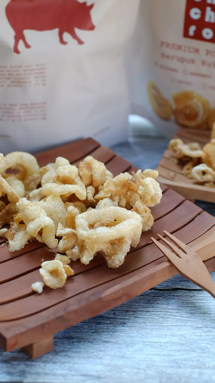 Chicharrón servido en tabla de madera, Brasa & Humo, San José
